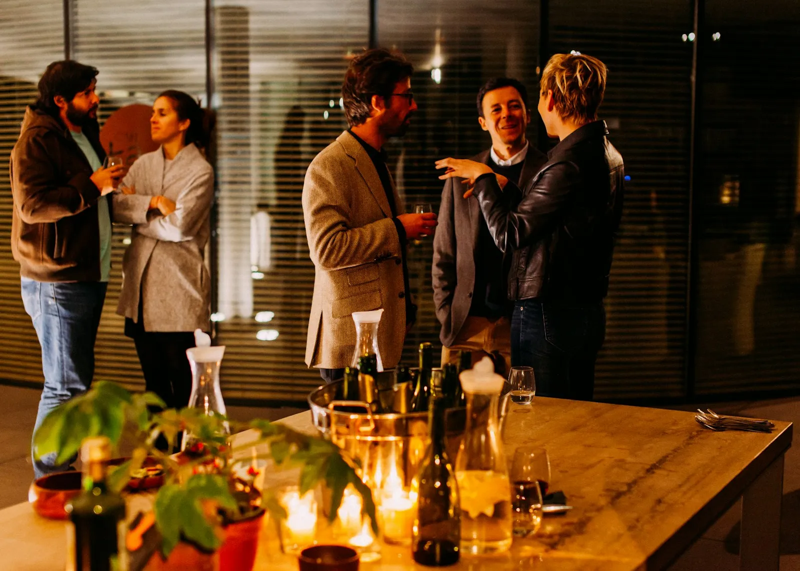Guests networking with signature cocktails at an event